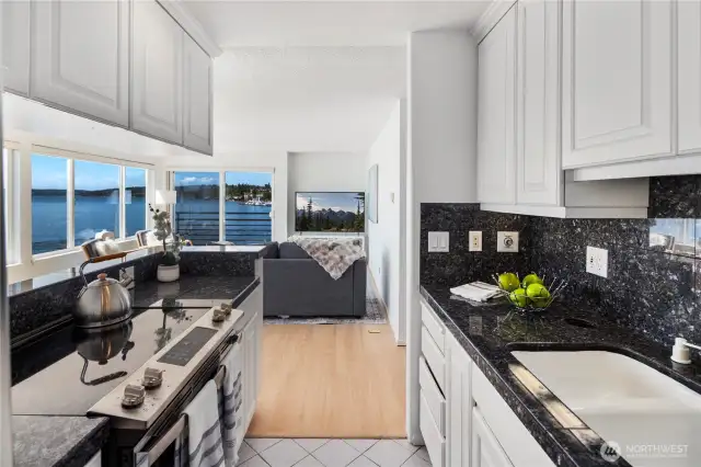 Everything is within easy reach in the kitchen with granite counter tops, new fridge and stove/oven.