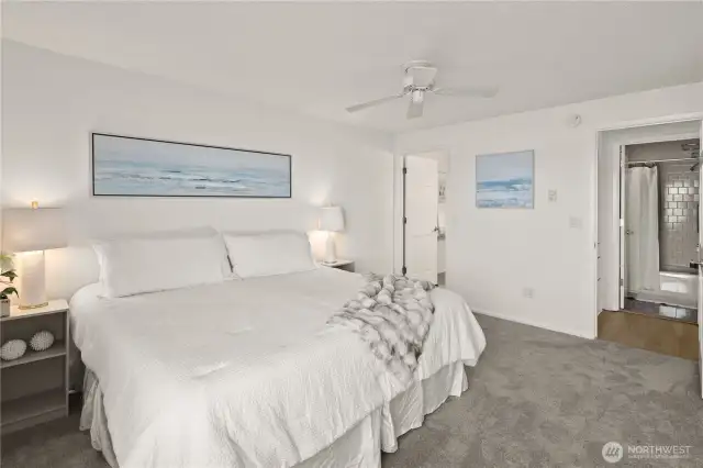 Primary bedroom features a view to the Kirkland marina and lake, and a full ensuite bathroom.