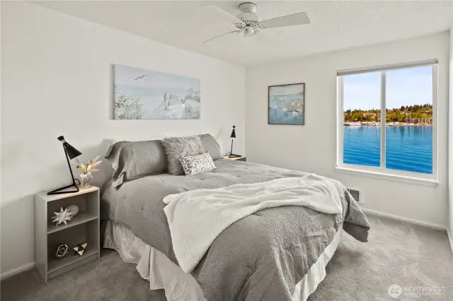 Second/guest bedroom features a view to the Kirkland Marina and lake.