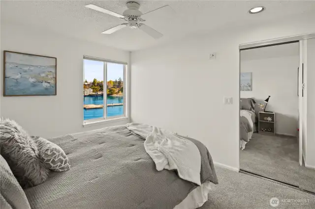 Second/guest bedroom features a view to the Kirkland Marina and lake.