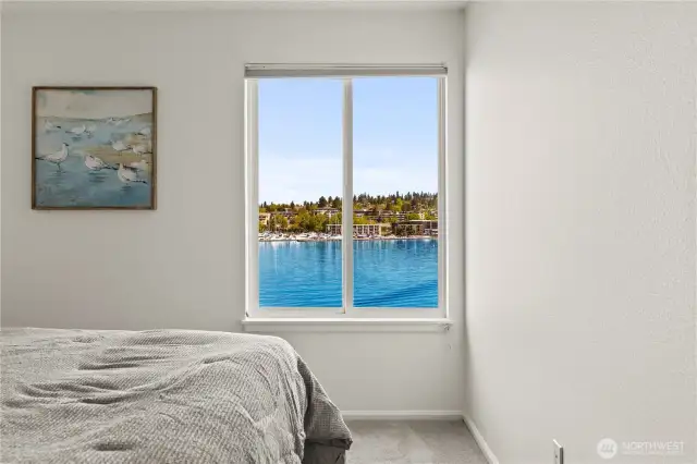 Second/guest bedroom features a view to the Kirkland Marina and lake.