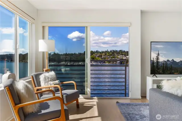 Step into the living room and take in the stunning view from the open sliding door—breathtaking scenery that’s hard to beat!