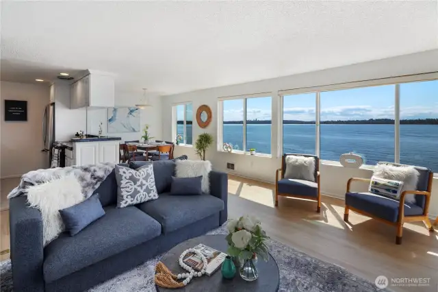Enjoy the floor to ceiling windows and views over the lake and Olympic mountains from the living room
