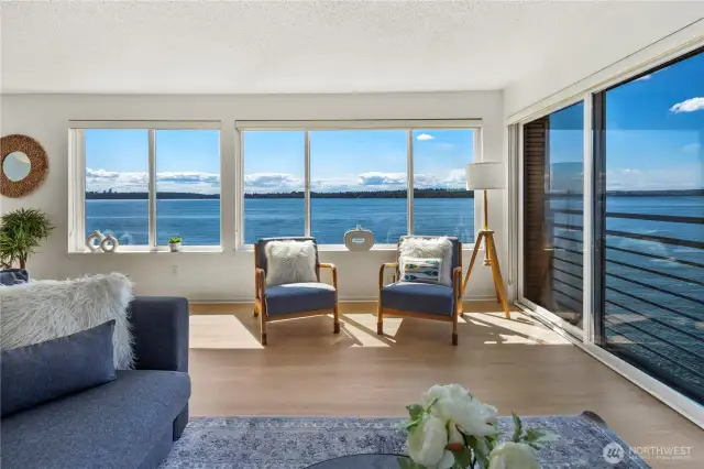 Enjoy the floor to ceiling windows and views over the lake and Olympic mountains from the living room!
