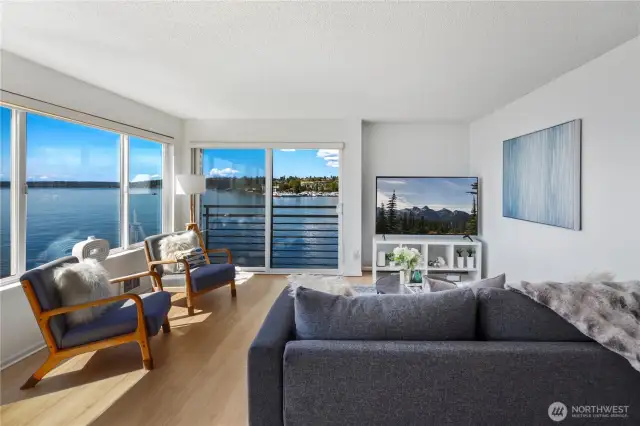 Enjoy the floor to ceiling windows and views over the lake and Olympic mountains from the living room!