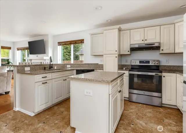 Beautifully updated kitchen featuring a spacious island and sleek newer appliances
