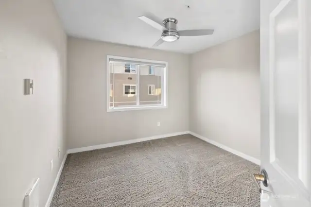 2nd bedroom with ceiling fan.