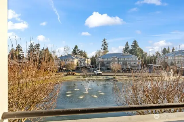 Water feature view from deck, living room, and primary bedroom.