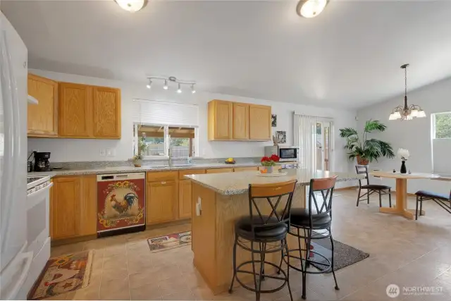 Kitchen view with the island. ALL counters are solid granite