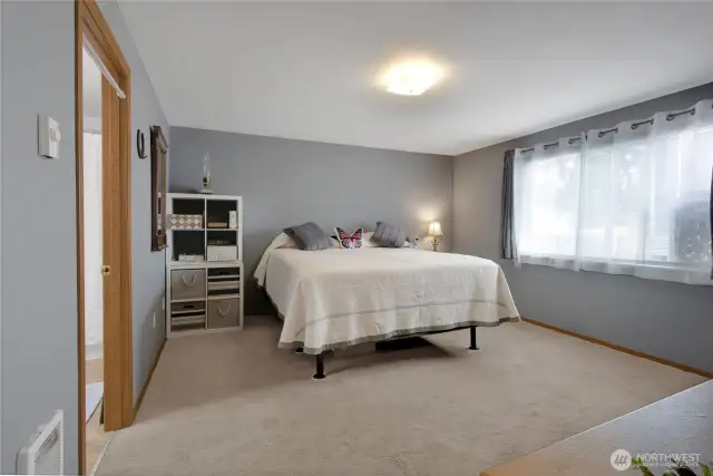 Primary bedroom nice size with walk in closet and bath with shower.