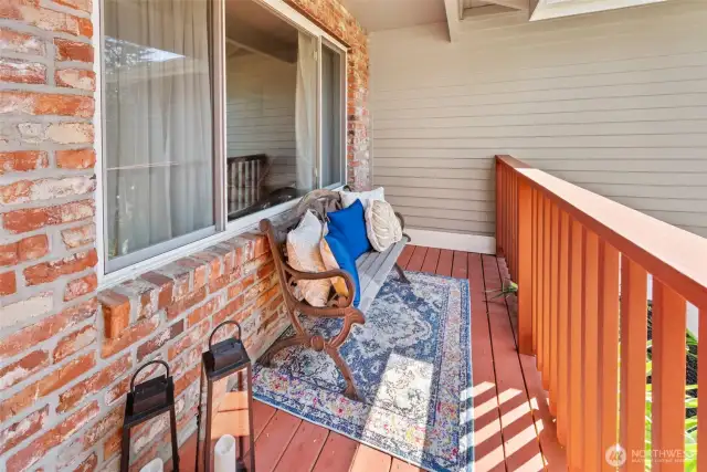 Covered front porch with seating area.