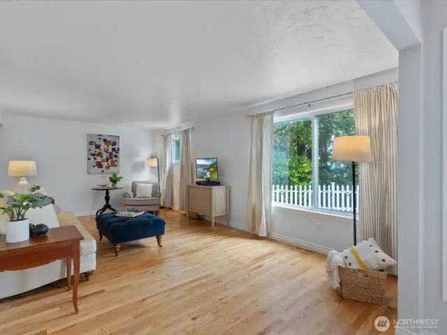 Gleaming hardwood floors throughout the main level.
