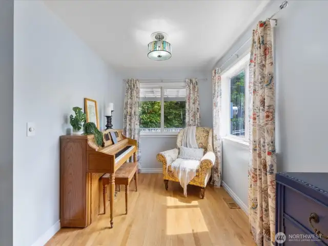 Currently the piano room, this would make a great office space or formal sitting area.