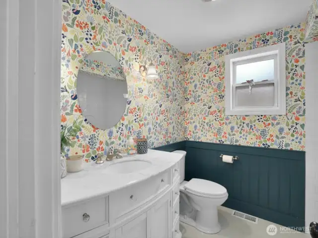 The fully remodeled bathroom showcases modern finishes and a clean, classic feel.