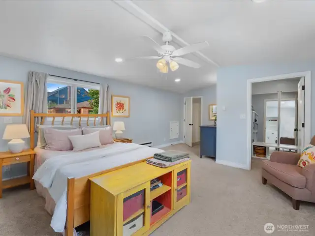 Another look at this spacious primary bedroom peeking into the large walk-in closet.