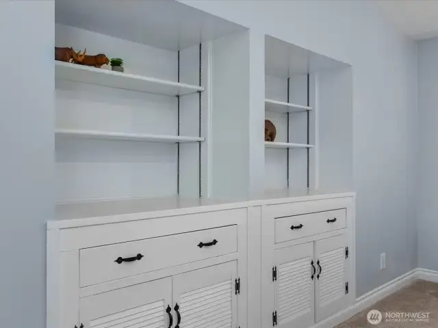 Massive custom built-in wall unit adds tons of storage and personality.