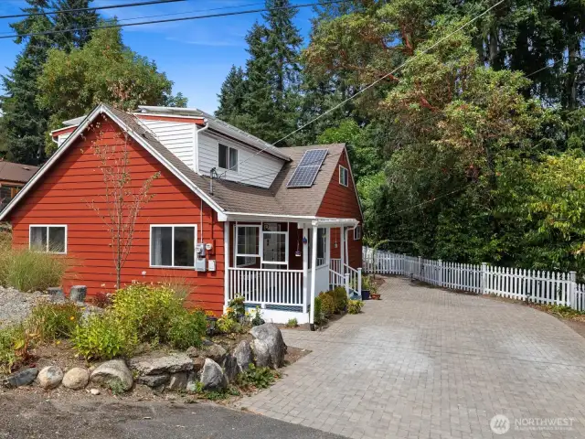 The eye-catching chevron-patterned brick driveway is not only beautiful—it offers generous parking.