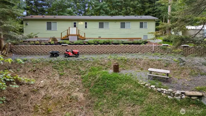 Drone shot of side of the home and the side yard