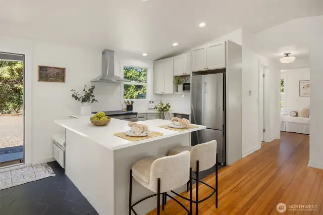 Fresh updates include new flooring in the entry and Kitchen, den/office, and bathroom.  The original 1942 Fir Floors were refinished giving them a fresh lease on time.  All new paint and hardware throughout as well.