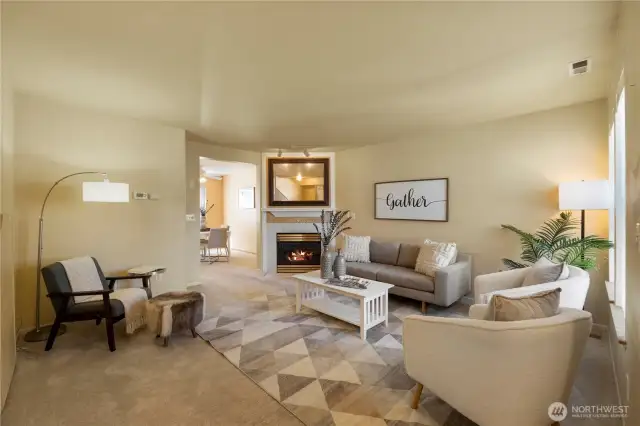 This living room is spacious and inviting. Note the gas fireplace for cozy evenings at home.