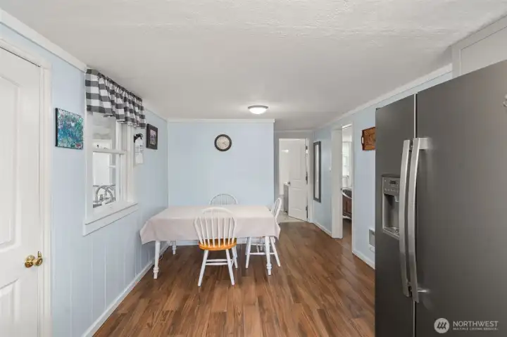 Dining room to an open kitchen area.