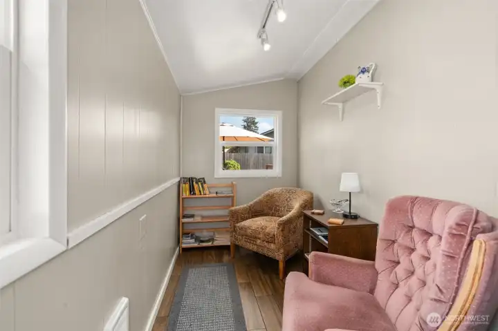 Tile floor, and lots of natural light make this room multifunctional.