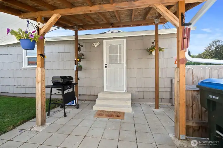 A nice covered back porch for BBQing year round.