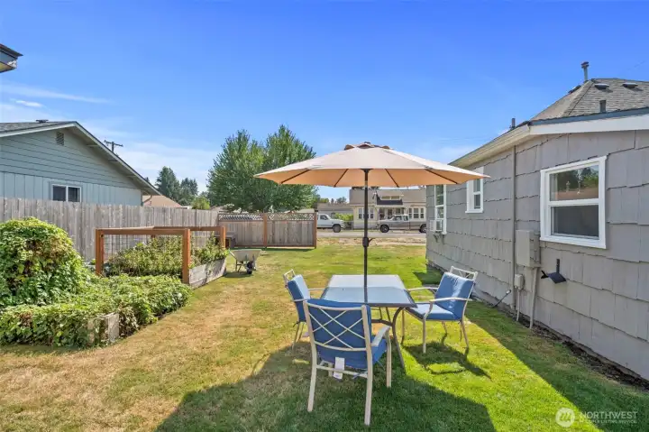 A lovely area to hang out with raised gardening beds.