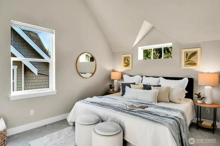 One of 2 spacious vaulted ceiling bedrooms on the top floor.