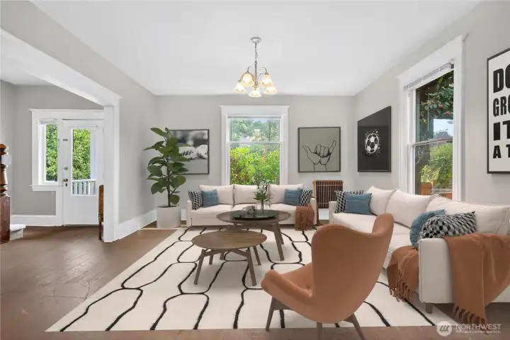 Comfortable shared space connects easily with the dining area. (Virtually Staged.)