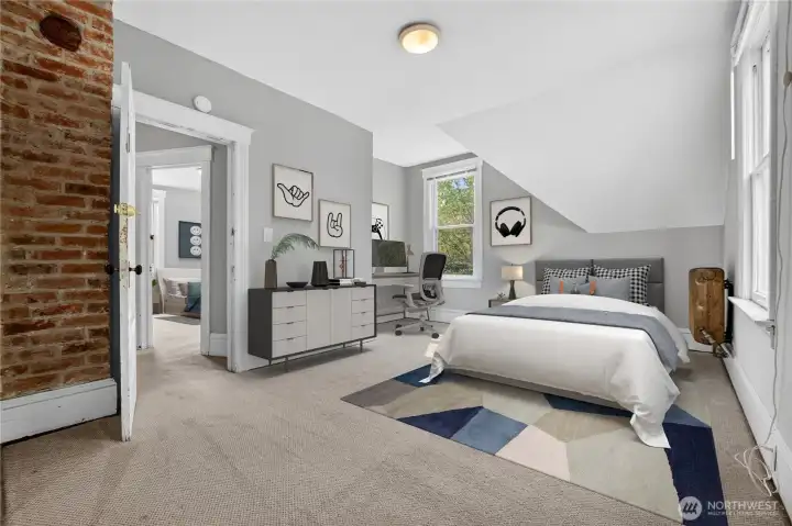 Largest upstairs bedroom with abundant natural light and walk-in closet. (Virtually Staged.)