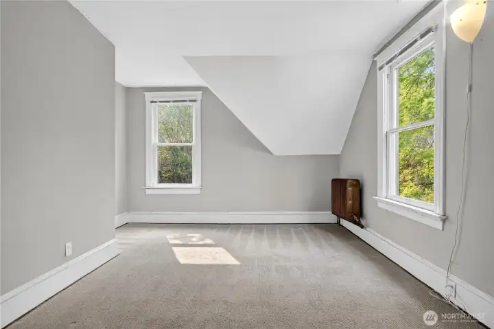 Largest upstairs bedroom unstaged.