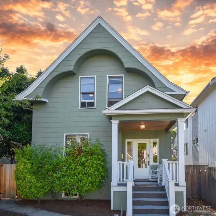 Front of home at twilight, showcasing the exterior and inviting entryway.