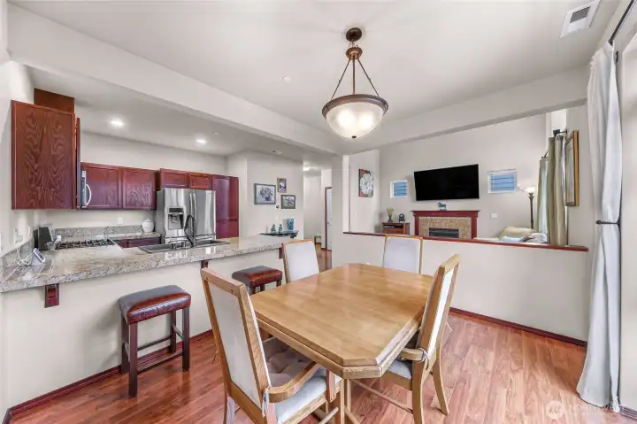 1/2 wall provides separation from main living to dining space