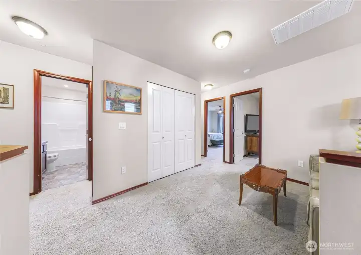 Flex space loft looking to utility closet, guest bath and 2 of 3 bedrooms