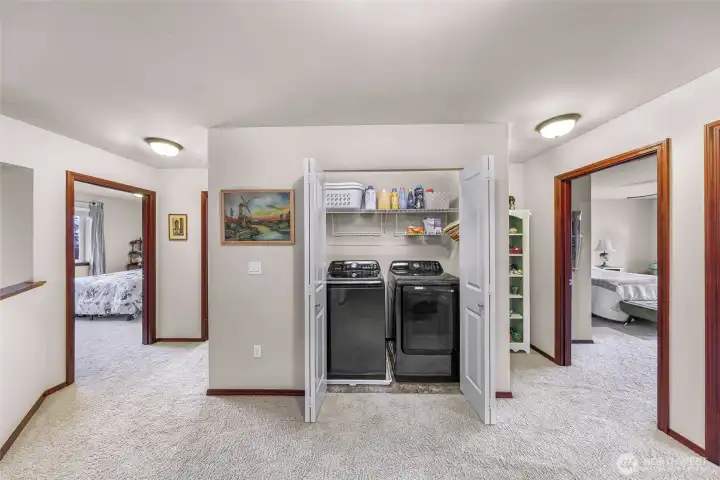 Full laundry in flex space and access to all three bedrooms and guest bath