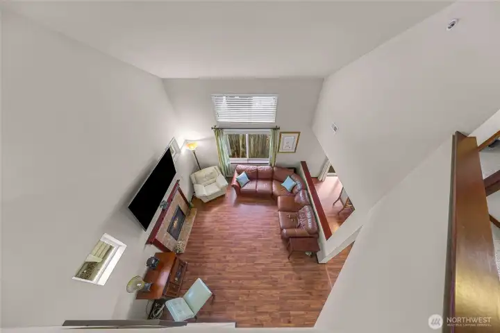 Looking down from flex space loft to living area