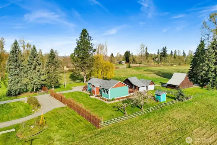 Country living at its best! This turn-key property features a tractor shed, barn with stalls and hay loft, open pasture, and an updated farmhouse—fully set up and ready for you to move in and enjoy.
