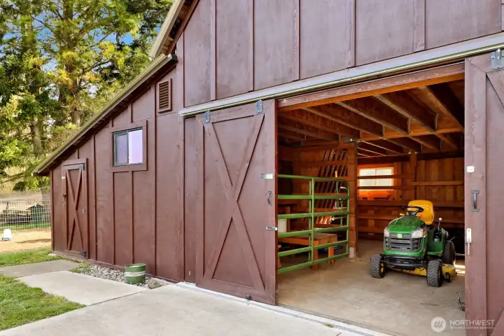 The barn is thoughtfully set up to accommodate both small and large livestock, offering flexible space for a variety of animals and farming needs.