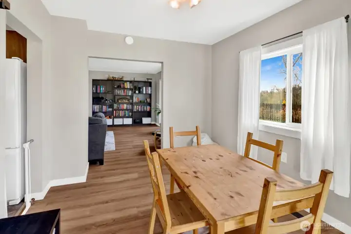 The dining room offers a comfortable space to gather, perfect for everyday meals or hosting friends and family.