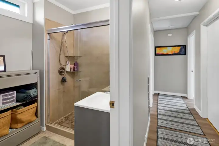 A convenient 3/4 bath featuring a nicely tiled shower, offering both style and everyday functionality.