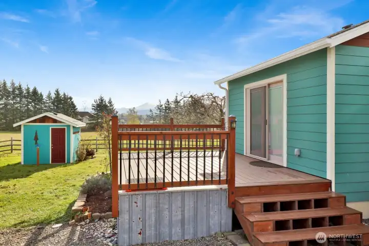 The primary bedroom opens directly to this private deck, offering a peaceful retreat with beautiful views of Mt. Baker and a true sense of seclusion.