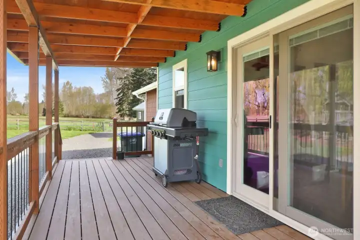 The west side deck features a slider off the dining room, creating an easy indoor-outdoor flow. It’s the perfect spot for rocking chair relaxation or firing up the grill and enjoying the fresh air.