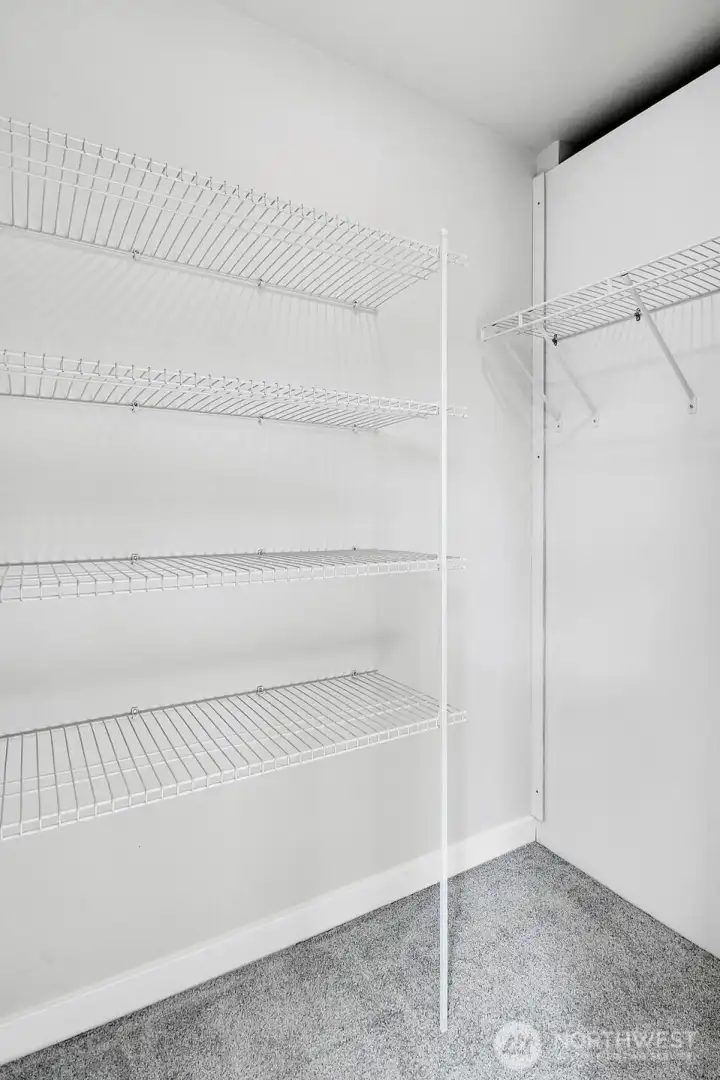 Primary walk-in closet.