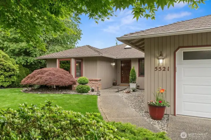 Classic entry- Mature and well cared for landscaping.