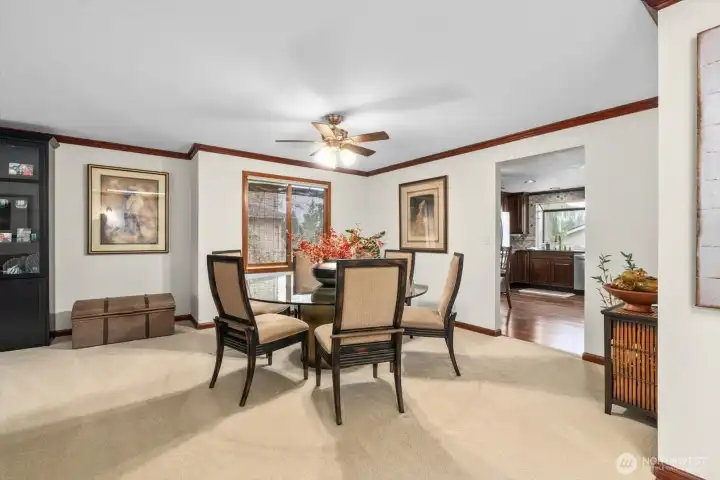 Formal dining area connected to front living room area.