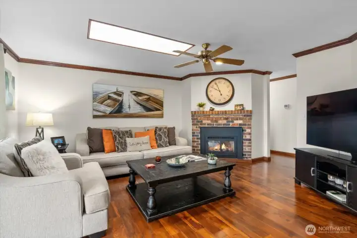 You can have it all- skylights for natural light, ceiling fan, hardwood floors, crown molding and a gas fireplace! In the summer- turn that off and turn on your AC- this home has air conditioning.