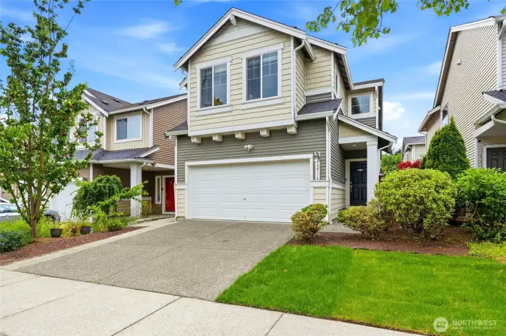 Front Elevation Welcoming exterior with mature landscaping, covered entry, and a spacious driveway, offering a warm and inviting first impression. Front Elevation Welcoming exterior with mature landscaping, covered entry, and a spacious driveway, offering a warm and inviting first impression.