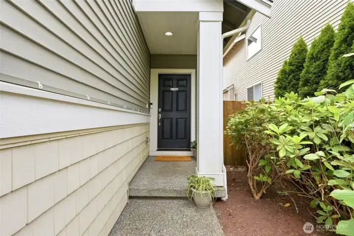 Covered Front Porch Charming covered entryway providing a sheltered welcome for guests and enhanced curb appeal with thoughtful landscaping and architectural details. Covered Front Porch Charming covered entryway providing a sheltered welcome for guests and enhanced curb appeal with thoughtful landscaping and architectural details.