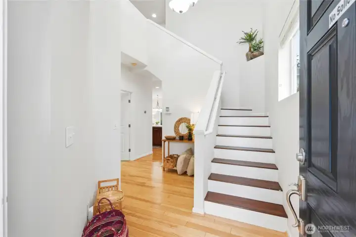 Entryway Welcoming two-story entry featuring soaring ceilings, abundant natural light, hardwood floors, and an elegant staircase that creates a bright and open first impression. Entryway Welcoming two-story entry featuring soaring ceilings, abundant natural light, hardwood floors, and an elegant staircase that creates a bright and open first impression.
